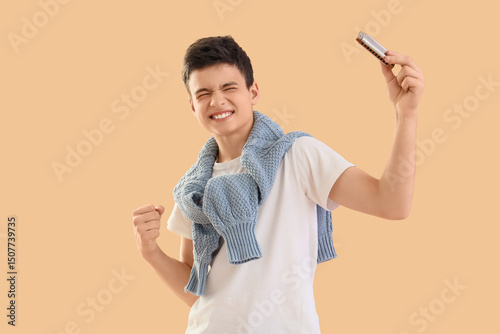 Happy teenage boy with harm...