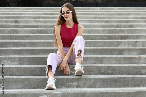 Beautiful young woman in st...