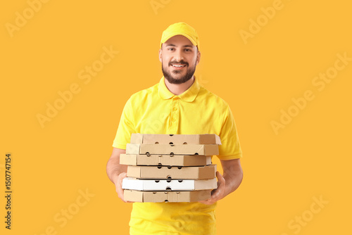 Male courier with many pizz...