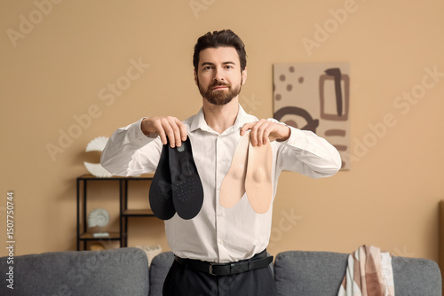 Young businessman with orth...