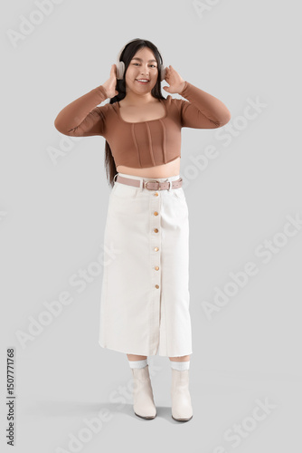 Young woman in headphones o...