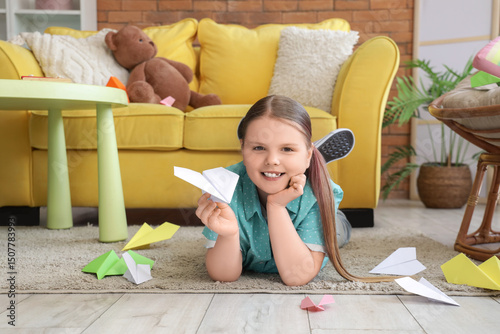 Cute girl with paper planes...