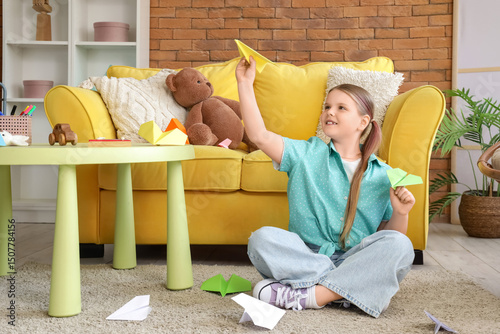 Cute girl with paper planes...