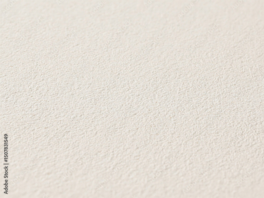 Close up view of a textured cream colored surface with a consist Close up view of a textured cream colored surface with a consist