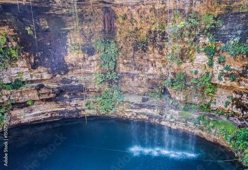 Mexico, 2019. The Sacred Cenote, or Well of Sacrifice, from pre-Columbian Maya era, at archaeological site of Chichen Itza. Were found sacrificed objects and human beings into the cenote. photo