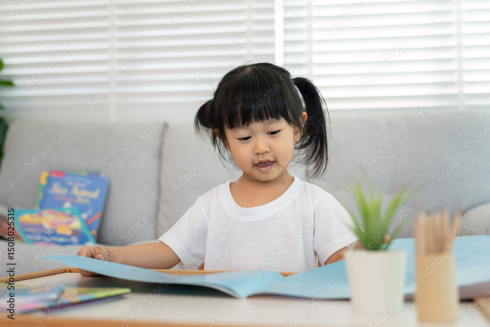 Happy Asian children relax read book at home. daughter and reading a story. learn development, childcare, laughing, education, storytelling, practice, imagine, reduce addiction mobile phone Happy Asian children relax read book at home. daughter and reading a story. learn development, childcare, laughing, education, storytelling, practice, imagine, reduce addiction mobile phone