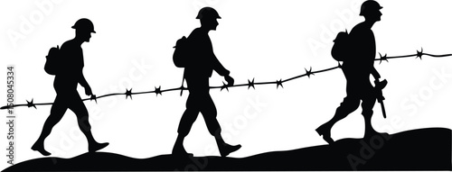 Silhouetted soldiers are walking along the terrain beside barbed wire; they appear to be steadfast