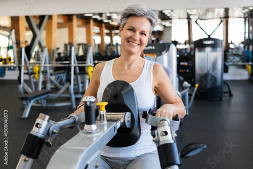 An elderly woman seniora with gray hair, athletic build and a good figure