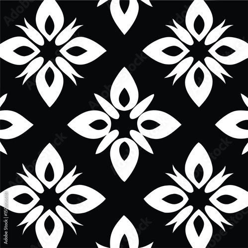 Black and white abstract floral arrangement creates a repeating geometric pattern design