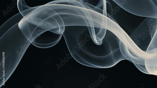 4K slow-motion footage of smoke or vapor gracefully moving and swirling in the air, creating a mysterious and ethereal atmosphere. Perfect for abstract, atmospheric, and artistic projects.
