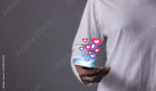 Love And Like Social Media Concept, Young Man hand using smart phone mobile, with Social Media, on soft blurred background