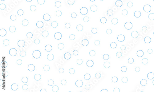 ラフな水色と青のリングドットがランダムに並ぶ水玉模様