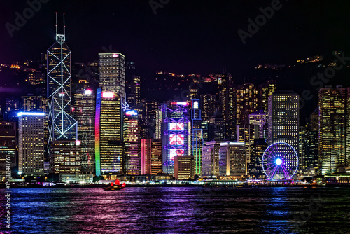 Vibrant Cityscape of Hong Kong Victoria Harbour at Night. The mesmerizing beauty of Hong Kong's Victoria Harbour at night, showcasing the dazzling illuminated skyline and reflections on the water.