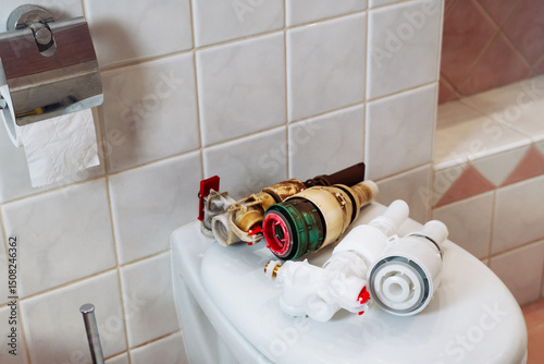 Replacement components for filling and flushing mechanism in toilet installations.