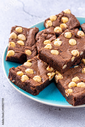 Homemade chocolate brownie photography . Top view on rustic background.Rich chocolate brownie , showcasing its dense texture and glossy surface, professional food photography.