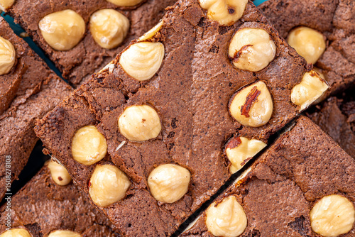 Homemade chocolate brownie photography . Top view on rustic background.Rich chocolate brownie , showcasing its dense texture and glossy surface, professional food photography.