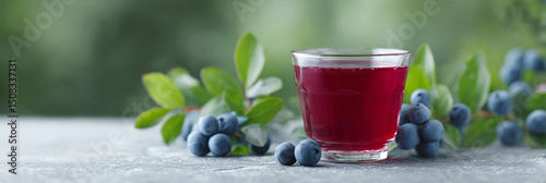 Rich bilberry juice in crystal glass, vibrant Nordic midsummer refreshment, antioxidant elixir for mystical Janopaksha rituals