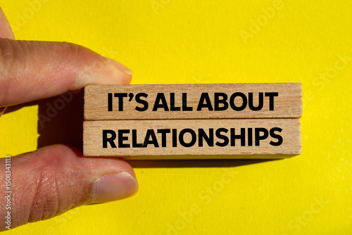 Photos It’s all about relationships message written on wooden blocks on yellow background