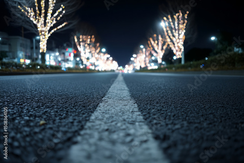 Blurred festive lights twinkle above a solitary road, enchanting the late-night wanderer amidst Yule celebrations and solstice reflections