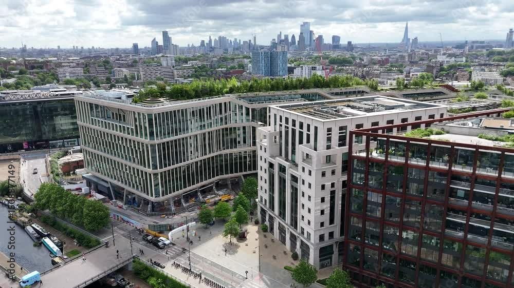 Aerial views of Coal Drops Yard, King's Cross Station, Rooftop Gardens and City Skyline. London’s dynamic blend of heritage and modern architecture.