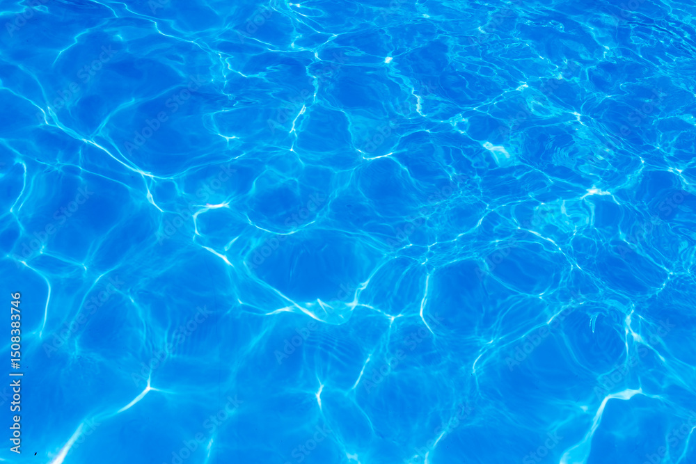 Clear blue swimming pool water surface with sunlight reflections creating abstract patterns and ripples, evoking a refreshing and tranquil summer vibe. Clear blue swimming pool water surface with sunlight reflections creating abstract patterns and ripples, evoking a refreshing and tranquil summer vibe.