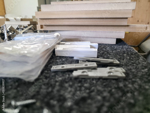 Crafting furniture components in a workshop with various tools and materials in use
