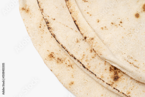 Thin lavash isolated on white background. Armenian unleavened lavash. Lavash as textured bread background.	
 photo