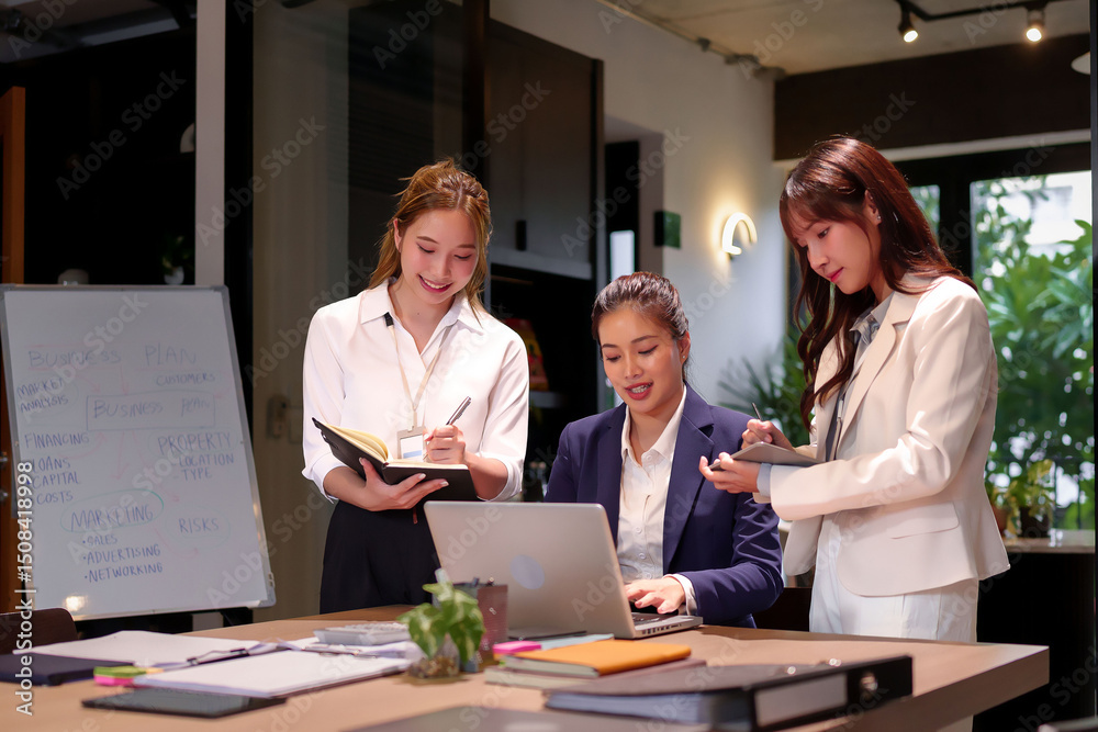 Fototapeta premium Asian Women Teamwork in Business Meeting Discussing Business Plan Brainstorming Ideas for Marketing Strategy and Financial Goals in Modern Office