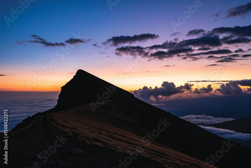 Hikers Silhouetted on Mountain Ridge at Sunset – Scenic Twilight Landscape