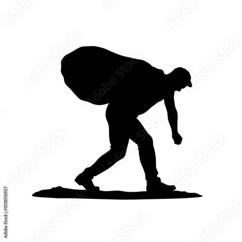 Silhouette of man carrying heavy bag while walking on ground  
