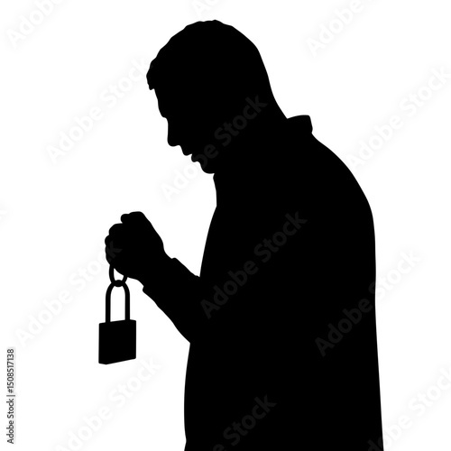 Man holding a padlock while looking down in silhouette form  