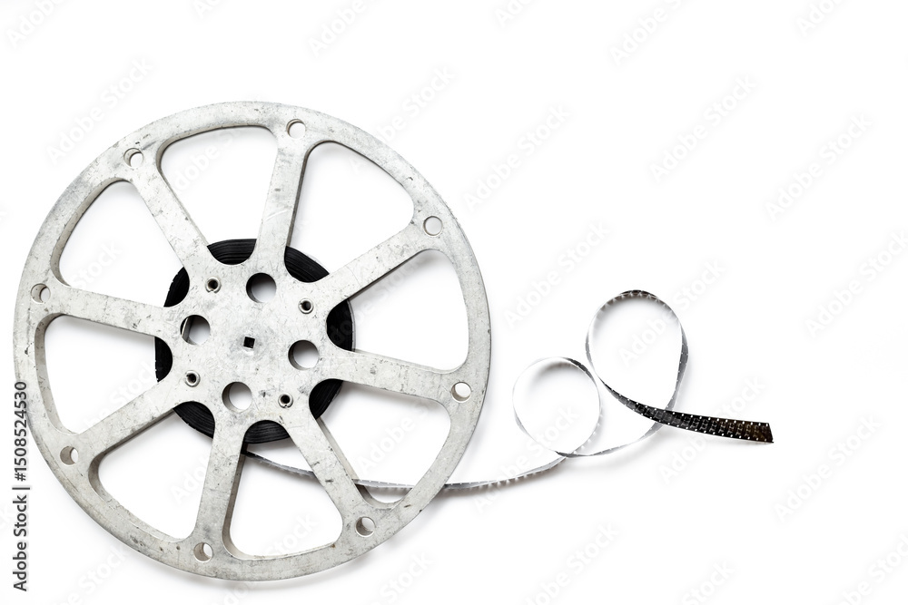 Obraz premium Old 35mm motion picture film reel on white background. Cinema concept