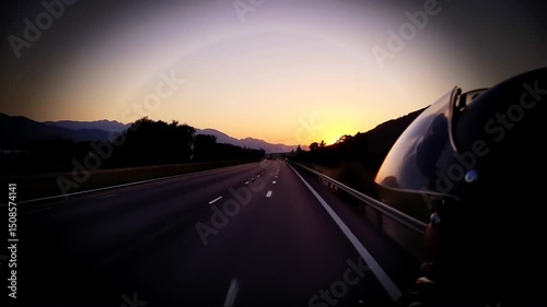 Riding Motorcycle at Sunset on Open Road Point of View