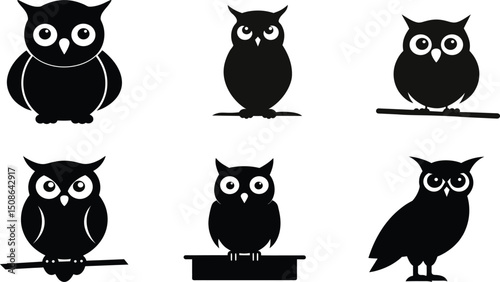 Silhouette of an owl sitting on a branch