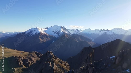 Mountain Range View With Snow-Capped Peaks and Clear Blue Sky