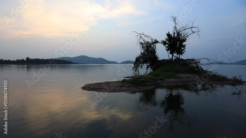 Natural video background of a high-angle atmosphere on a mountain that overlooks the surrounding scenery(mountains, trees,sea)from a scenic vantage point,with a wooden chair for sitting and resting photo