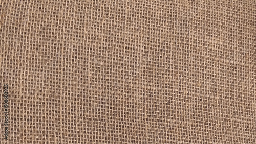 Coarse natural burlap fabric. The texture of natural burlap.