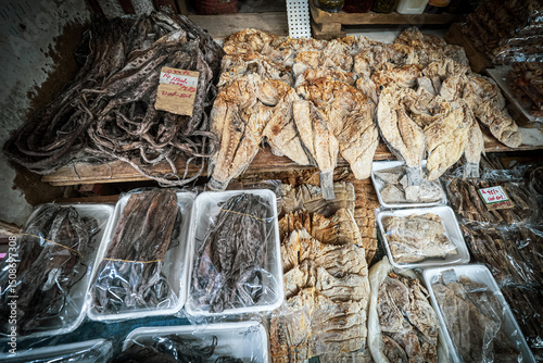 View of dried and salted octopus and fish packed into containers and plastic bags, ready for sale at the fish market in Port Louis, Mauritius, Africa