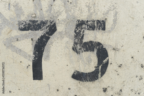 number 75 on a wall