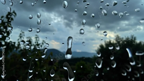 Raindrops on Glass with Distant Mountain View