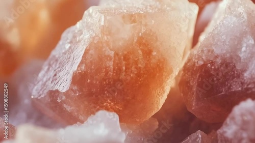 Closeup of rough pieces of Himalayan pink salt crystals, showcasing texture, structure, mineral composition, culinary ingredient and light reflection