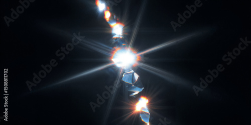 Bright light beams shining through broken glass on black background