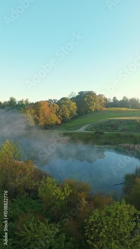 Wallpaper Mural Vertical screen misty sunrise view showing river and green fields near Johnson City Tennessee USA Torontodigital.ca