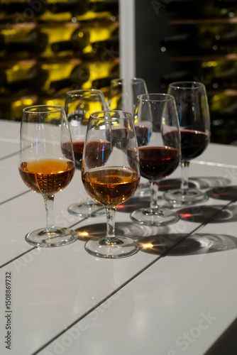 port wine testing, glasses with drink - white and red