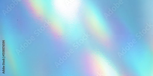 Iridescent holographic texture reflecting rainbow light beams on blue background