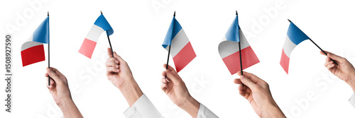 The France flag in hand in different angles on a white background