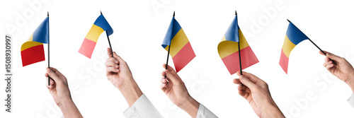 The Chad flag in hand in different angles on a white background