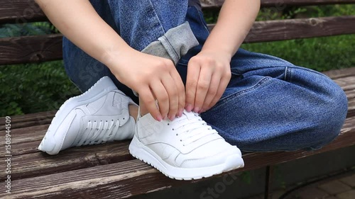 girl reconciles new shoes buying clothes from an online store genuine leather sneakers sneakers white 