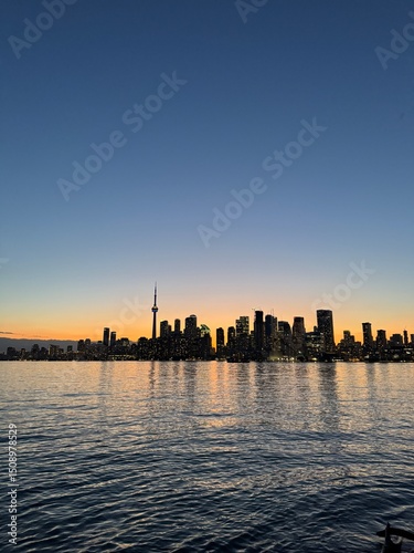 Toronto Skyline at Sunset Over Still Waters
