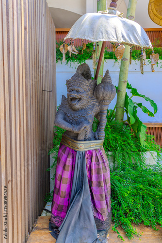 Ubud Bali is a very historical and religious cultural city with statues of Hindu Gods and ornate decorated buildings and doors. Balinese revere their gods in Bali Indonesia 